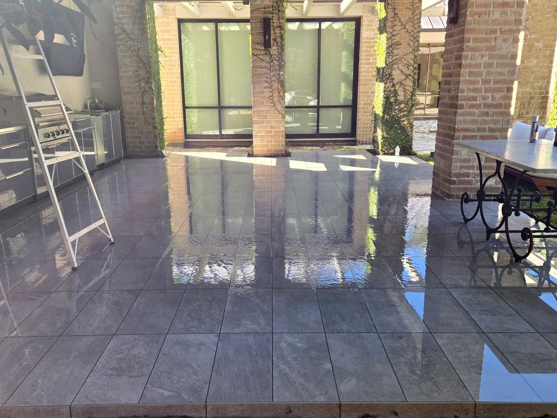 Outdoor tile patio washed to a mirror shine